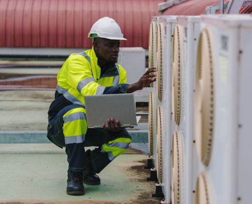Technicians Are Inspecting The Air Conditioning And Refrigeration Systems In A Commercial Building