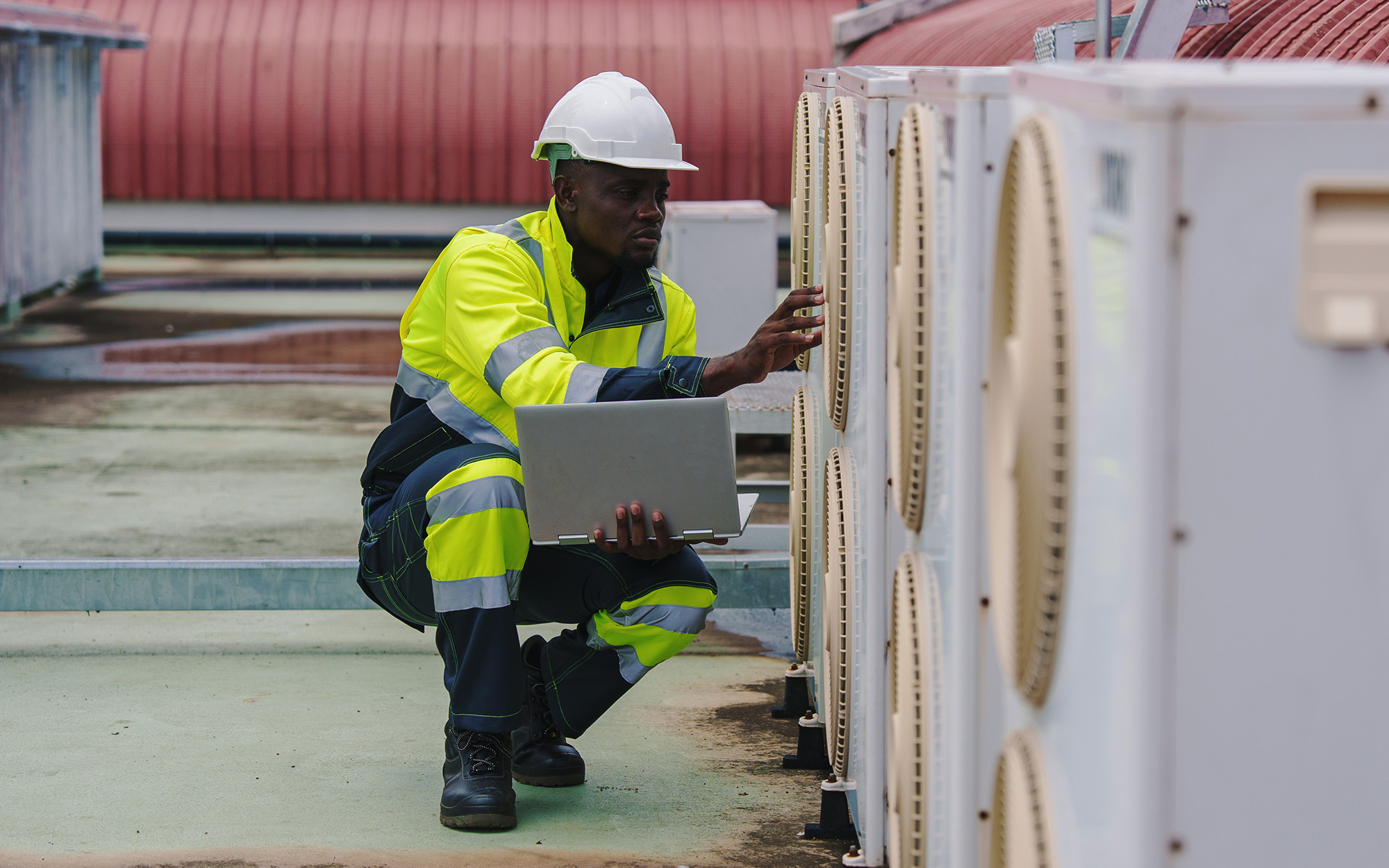 Technicians Are Inspecting The Air Conditioning And Refrigeration Systems In A Commercial Building